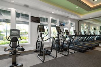 the gym at the inn atrium has cardio equipment and windows